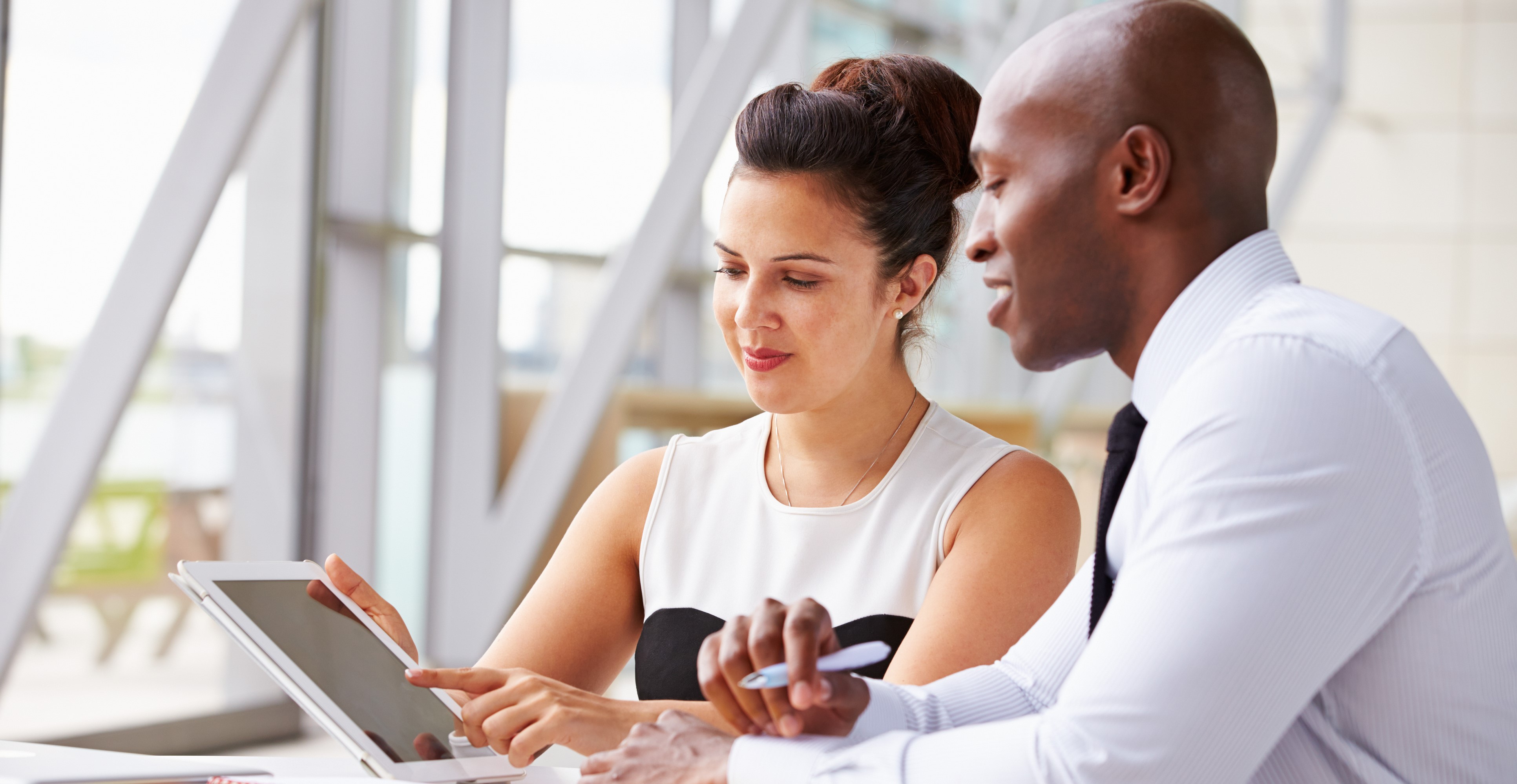 Two corporate business colleagues working together in office