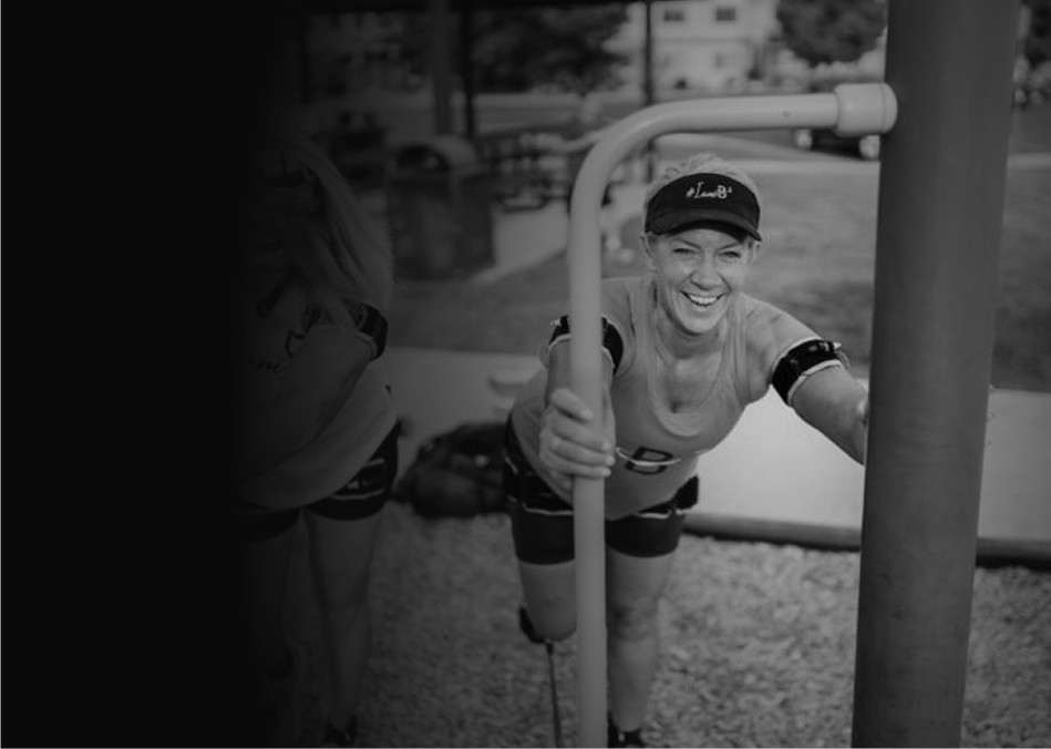 Woman exercising outdoors while wearing B3 Bands on her upper arms and thighs